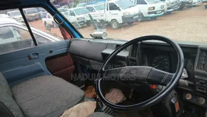 Isuzu Elf White and Blue Truck