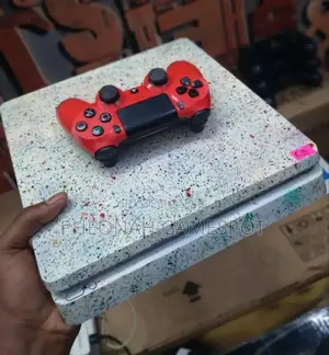 Ps4 Slim Console With a Massive 1tb Storage 25 Games and 2 Controllers