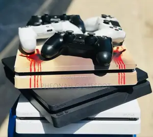Used Ps4 Slim Console With 13 Games and Two Controllers Included!