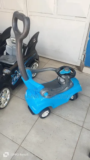 Uk Used Blue Baby Push Car With a Parental Handle.