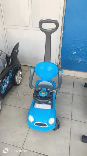Uk Used Blue Baby Push Car With a Parental Handle.