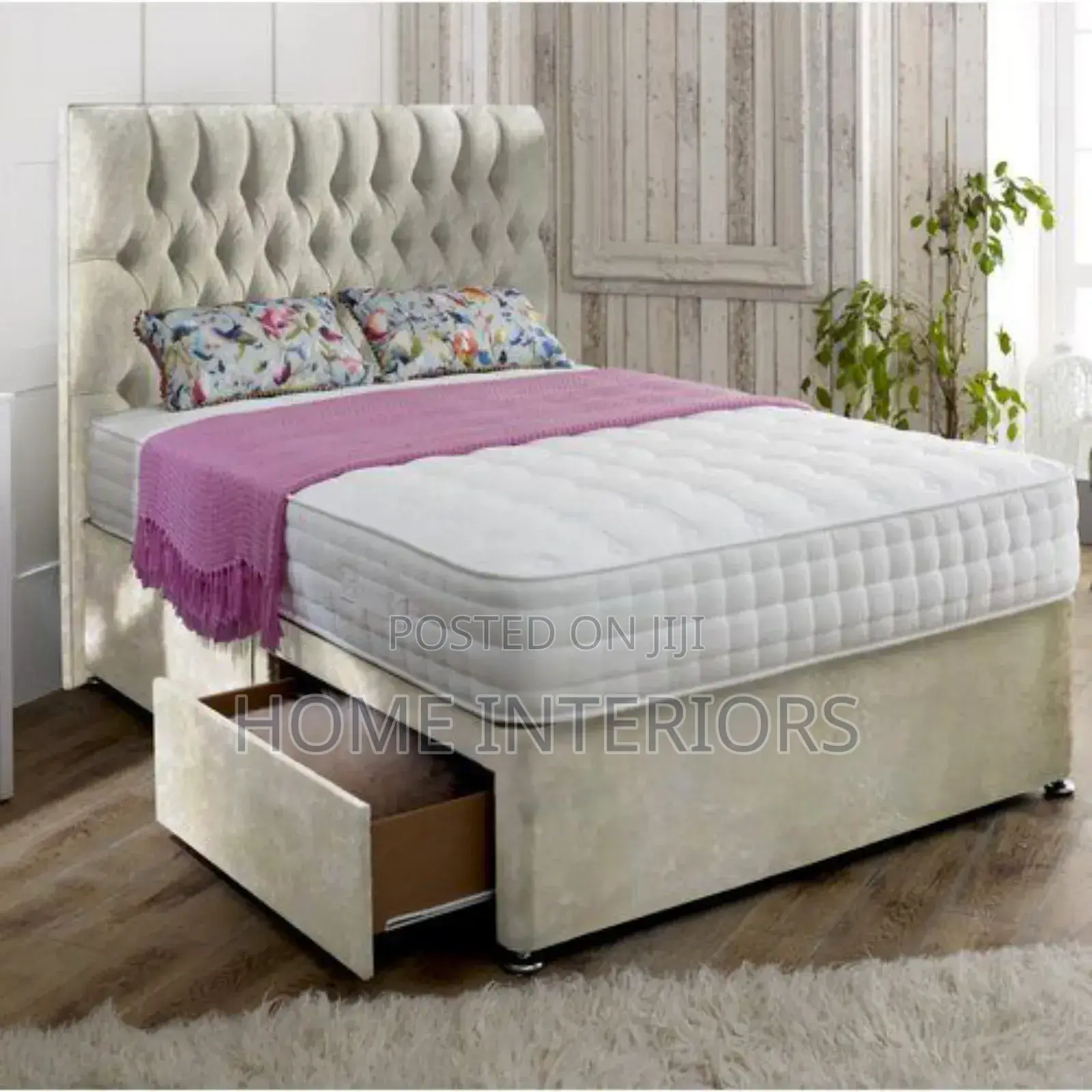 A Light Gray Bed With a Drawer