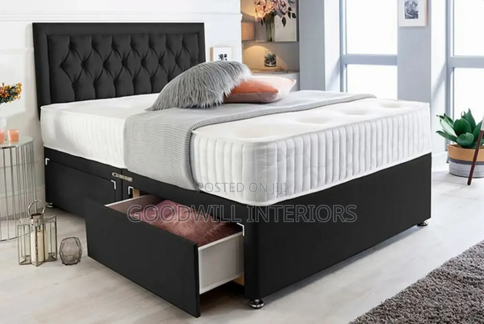 A Black Bed With a Storage Drawers