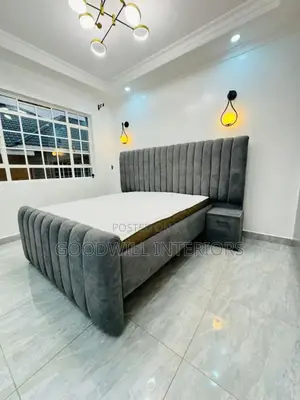 A Gray Bed With a Mattress