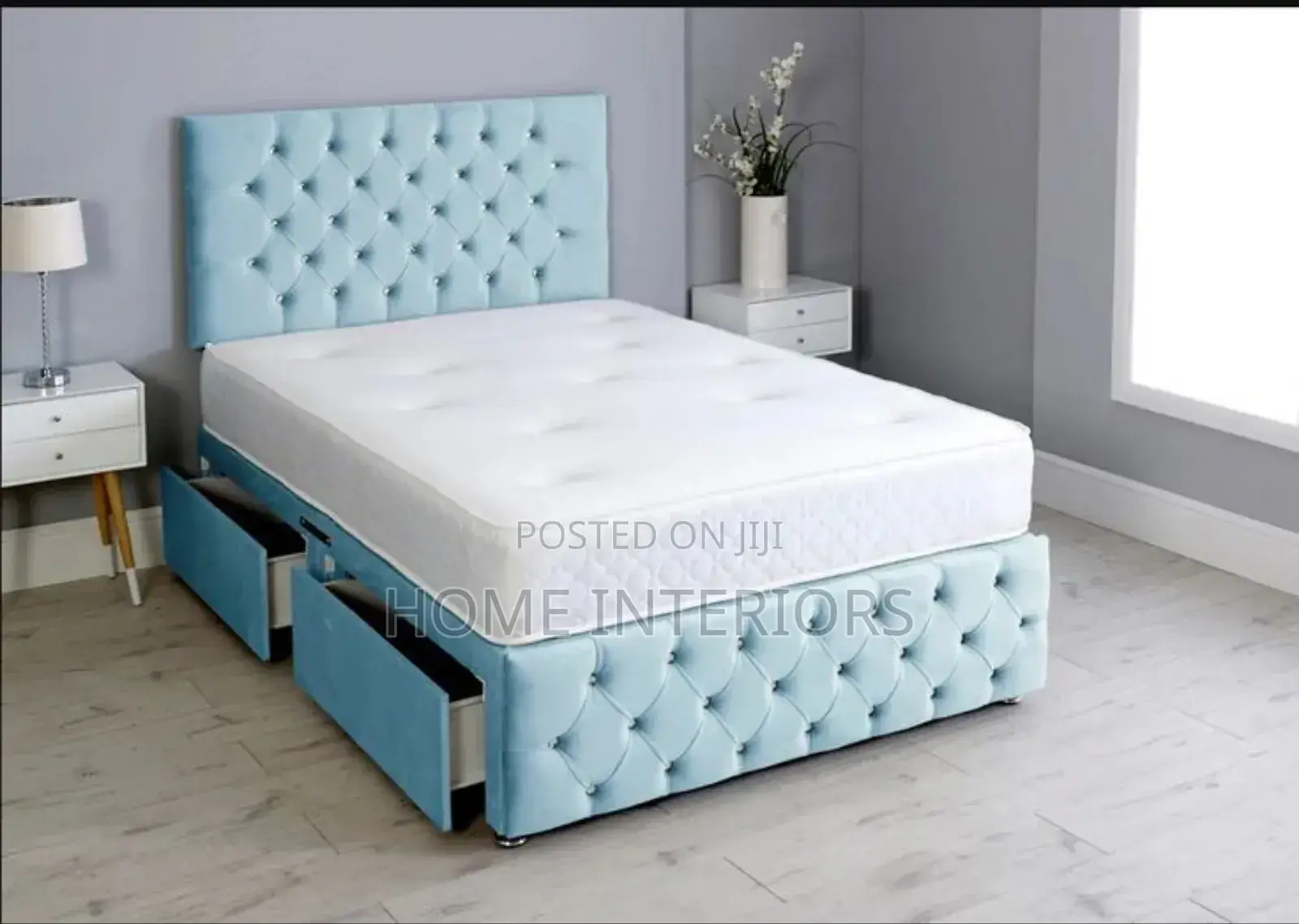 A Light Navy Blue Bed With Two Storage Drawers