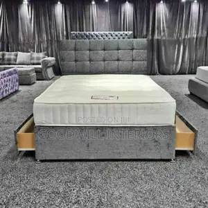 A Gray Bed With Storage Drawers