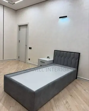 A Bed in Gray Colored With One Drawer