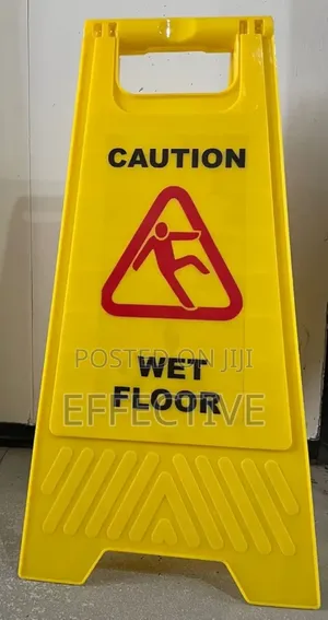Yellow Board With Massage Of Caution Wet Floor Signs