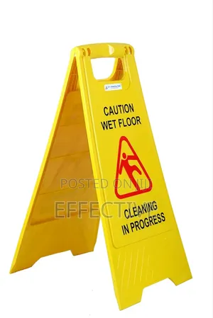 Yellow Board With Massage Of Caution Wet Floor Signs