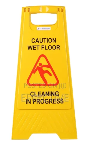 Yellow Board With Massage Of Caution Wet Floor Signs