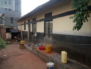 Land On Salama Road With Rental Shops And House On Sale