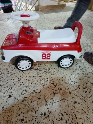 Red and White Ride-on Toy Car for a Child.