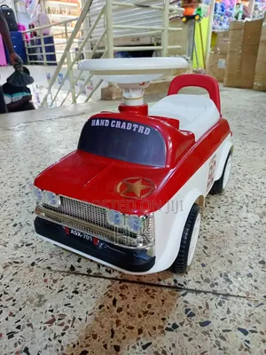 Red and White Ride-on Toy Car for a Child.