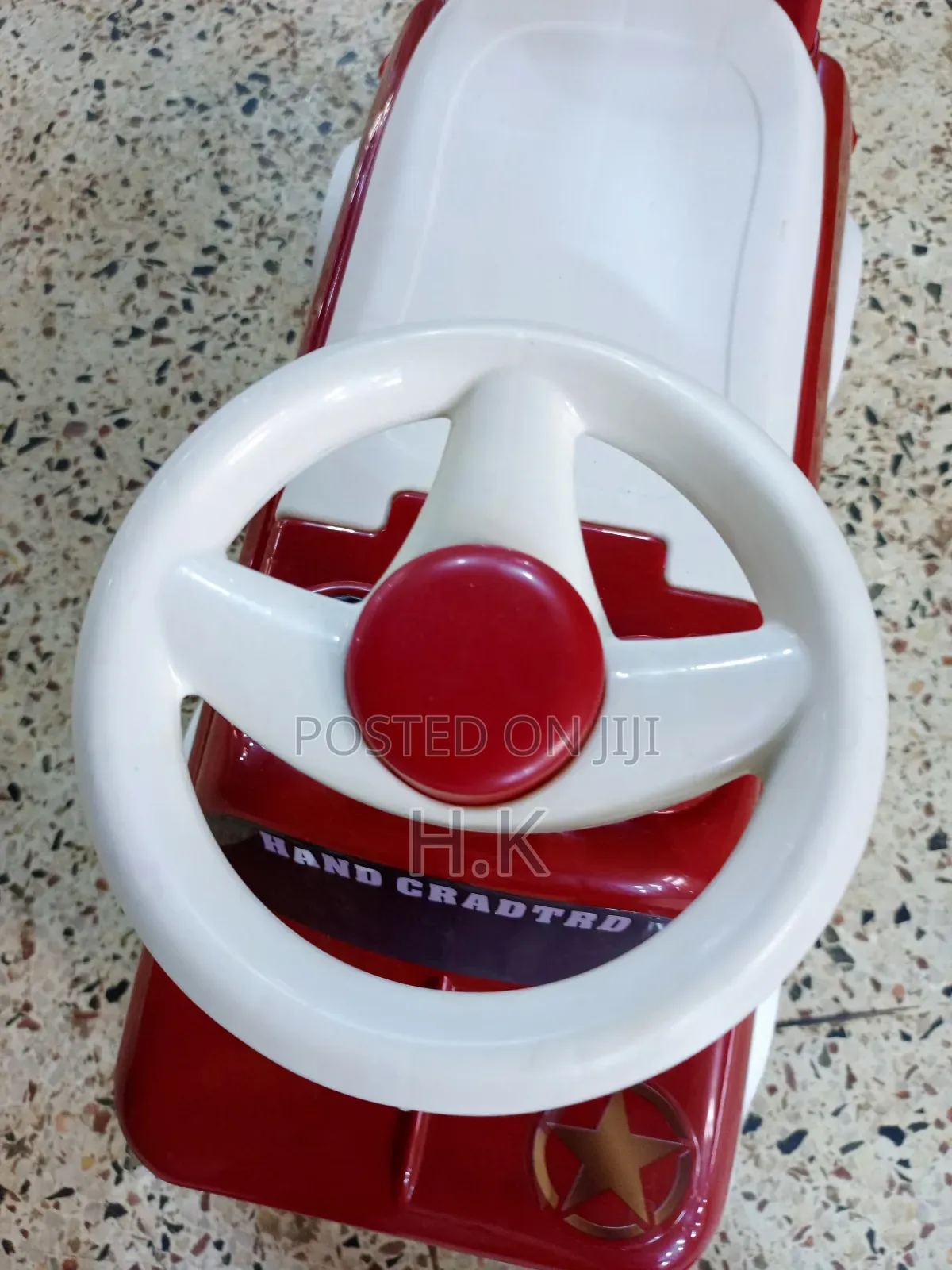 Red and White Ride-on Toy Car for a Child.
