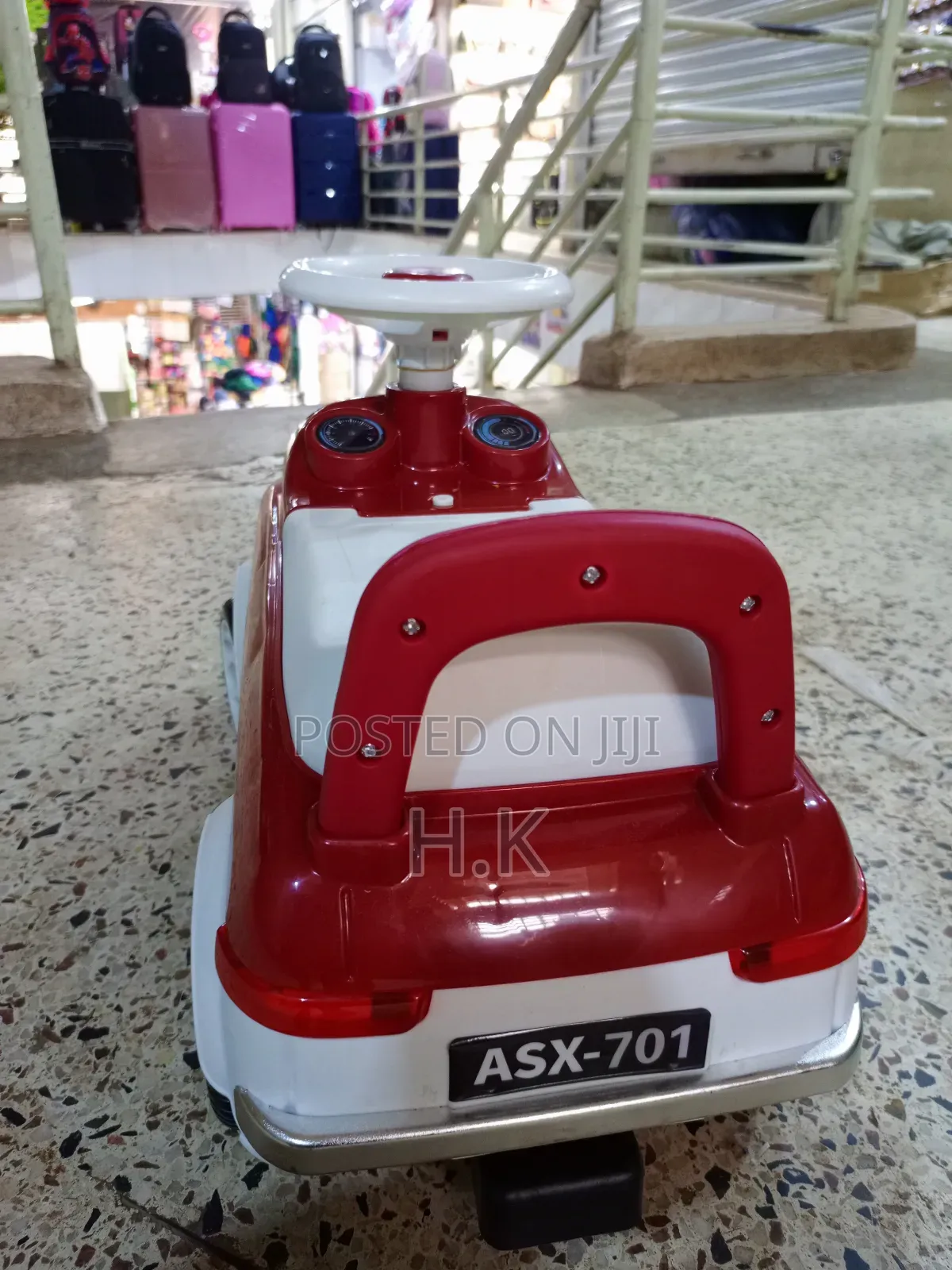 Red and White Ride-on Toy Car for a Child.