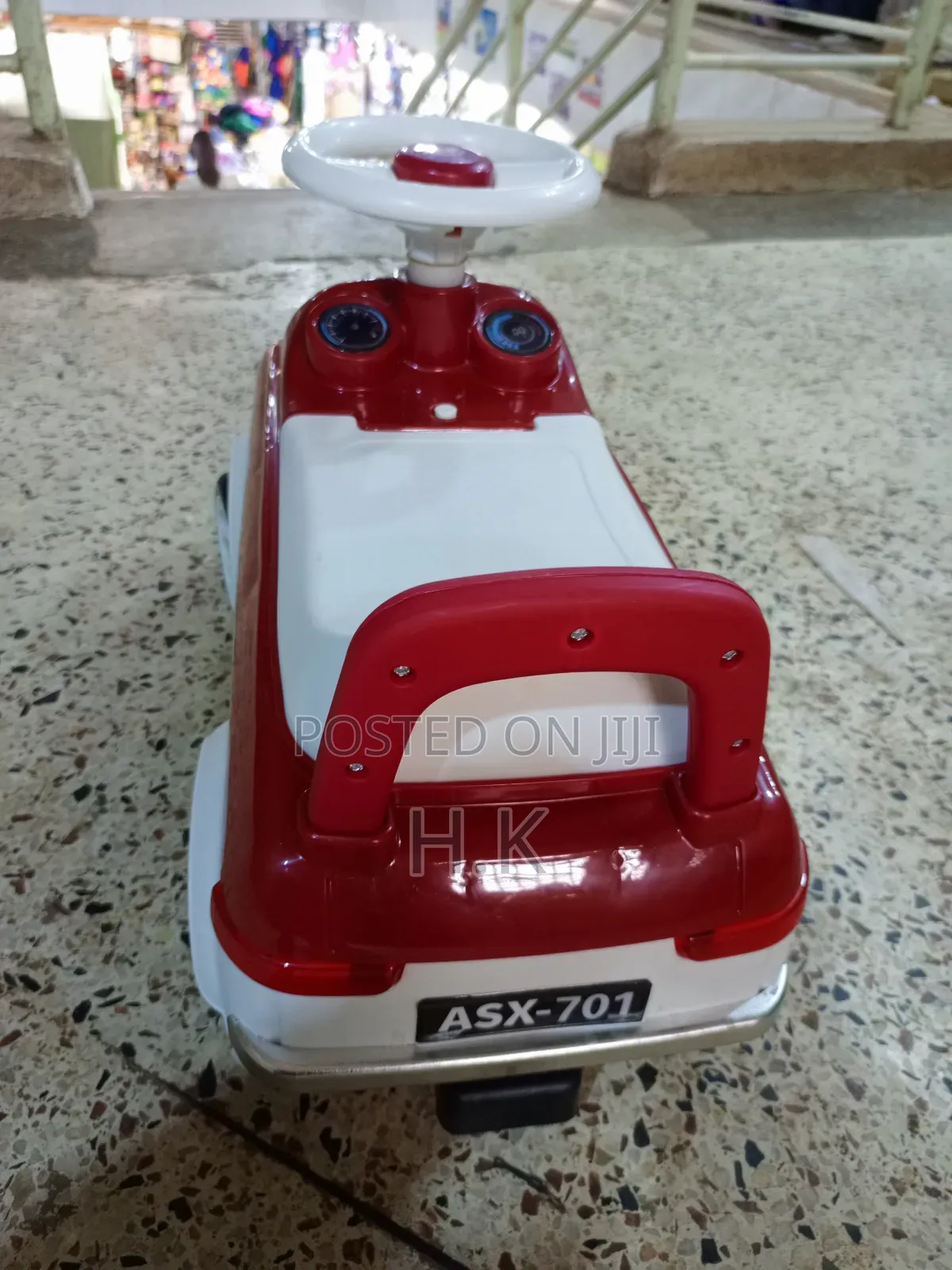 Red and White Ride-on Toy Car for a Child.