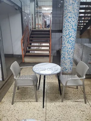 Black Stand Dining Table and Plastic Chairs Set