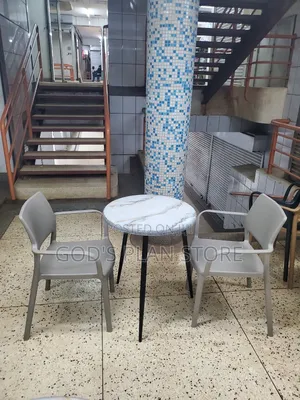 Black Stand Dining Table and Plastic Chairs Set