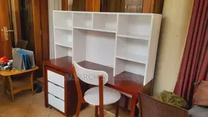 Reading Table in White and Mahogany Color With a Chair