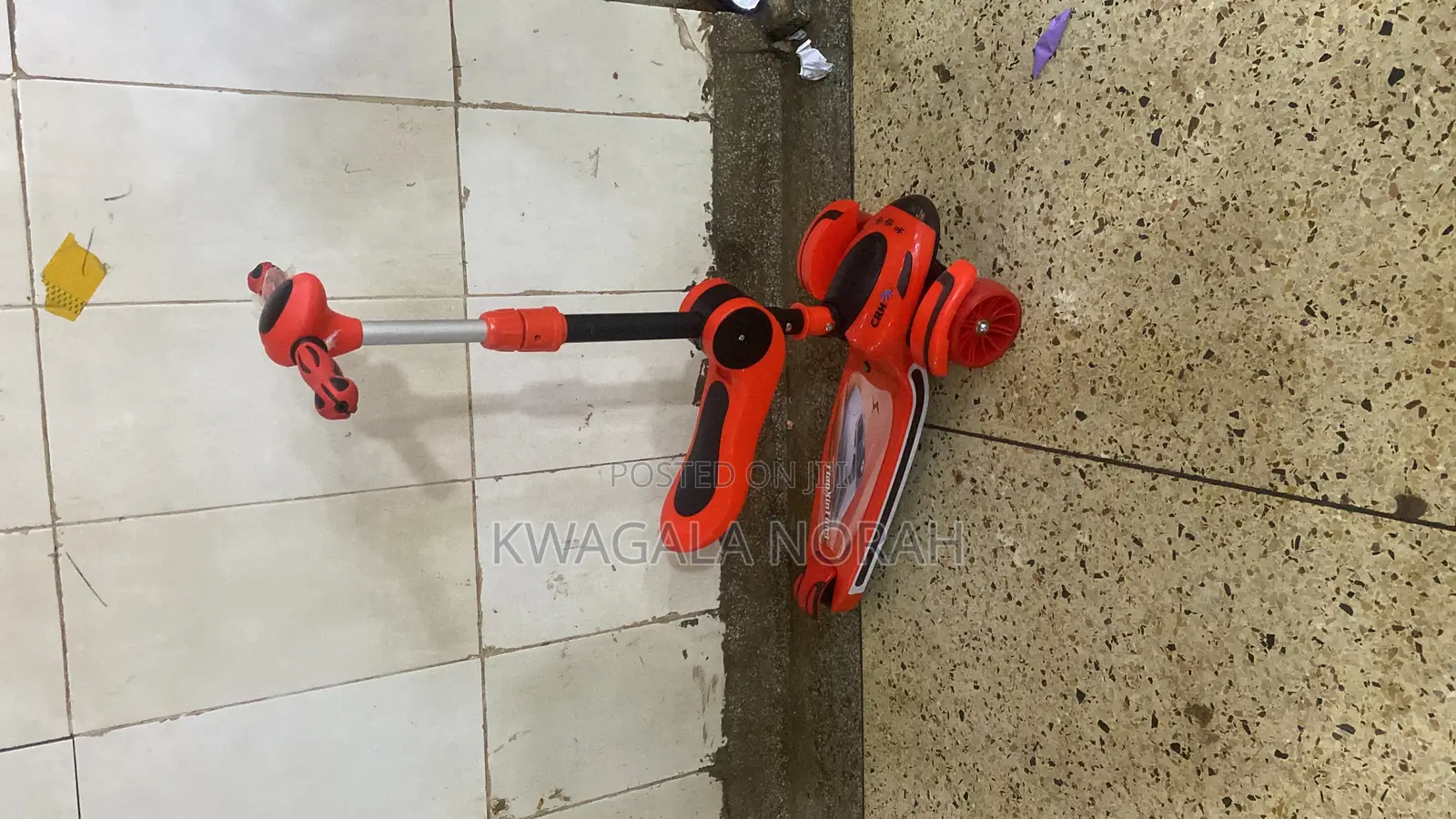 A 4 - Wheel Kick Scooter for Kids