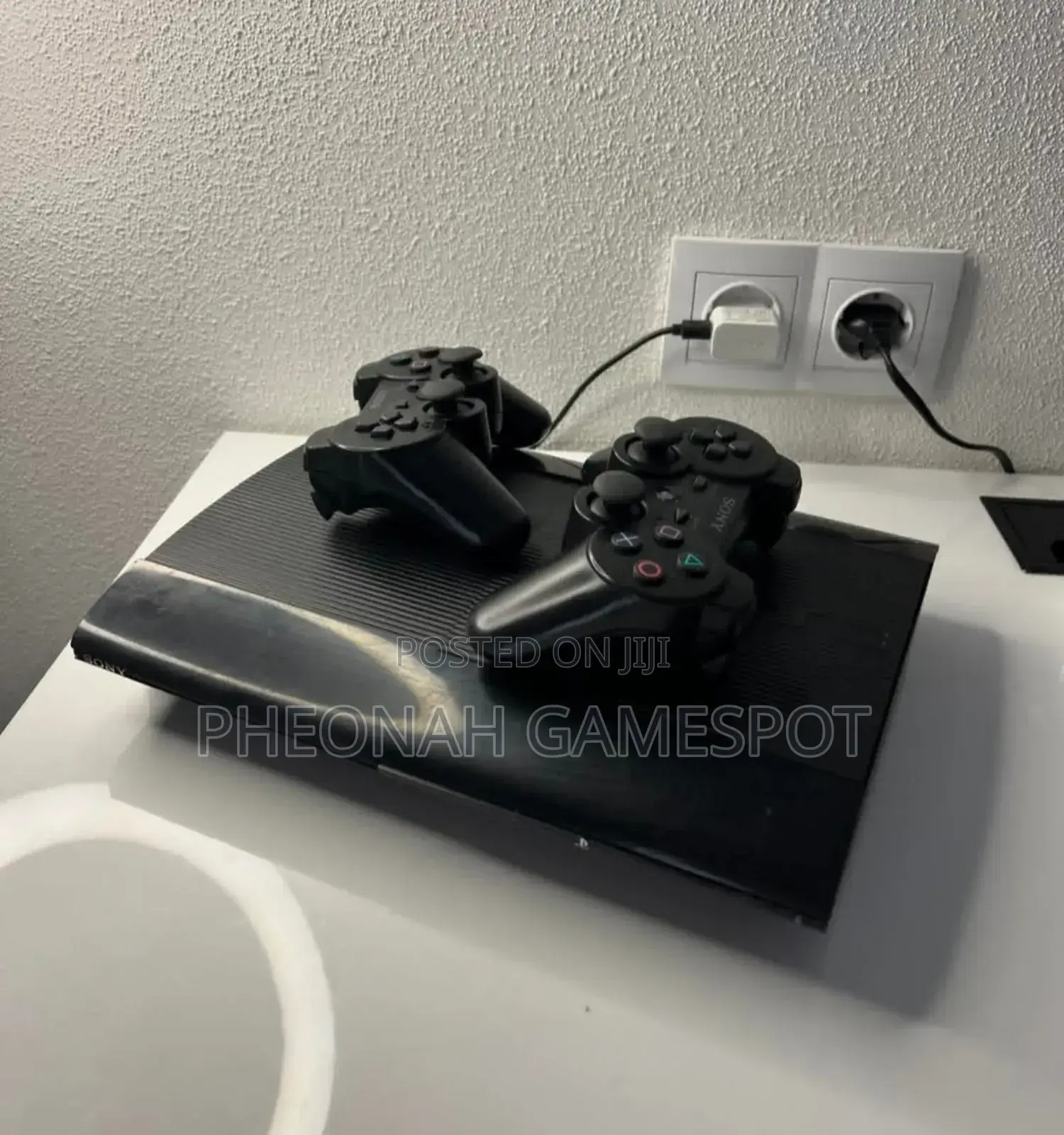 Used Ps3 Super Slim With 15 Games and Two Controllers - Full Kit.