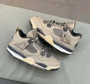 Air Jordan 4 Retro "Cave Stone and Black" Sneakers.