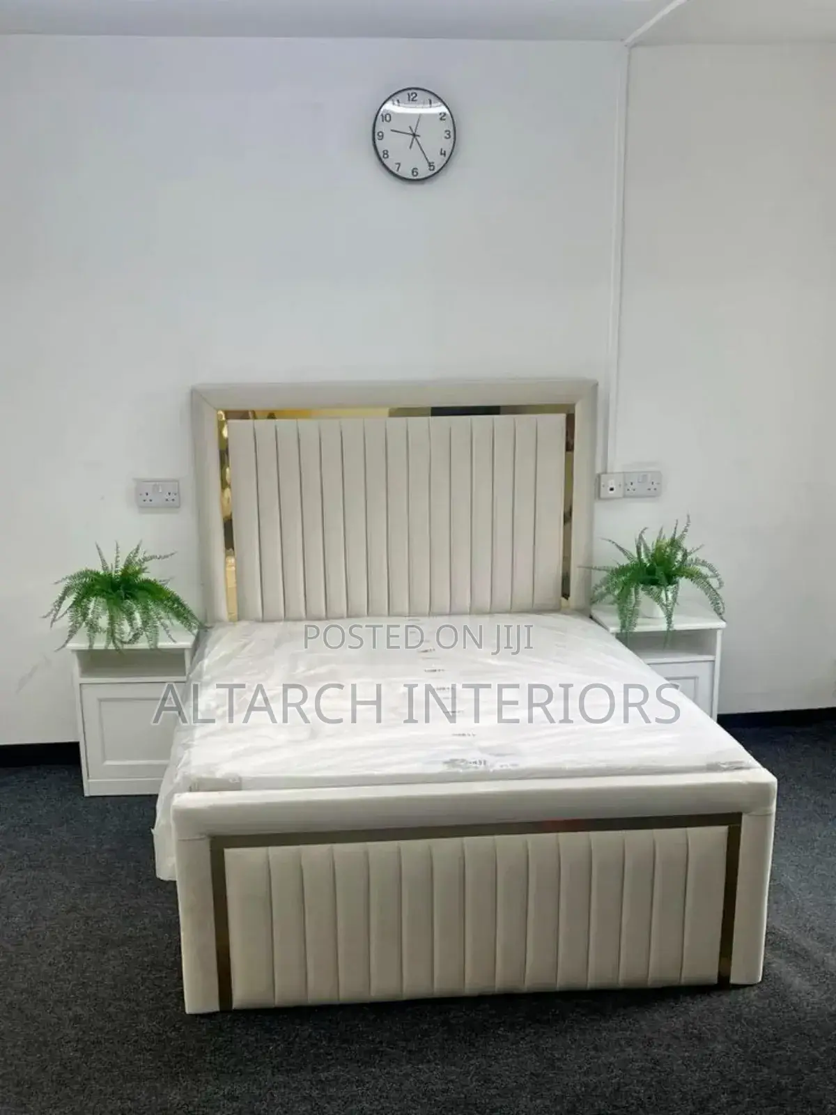 White Dressed Leather Bed With Gold Strips and Bedside Drawers