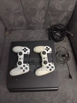 Playstation 4 Slim ( With Two Brand New Controllers and Games )
