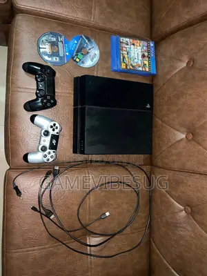 Playstation 4 Standard ( Two Brand New Controllers and Games)