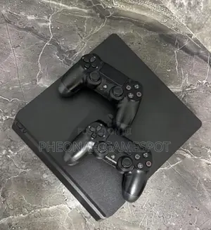 Ps4 Slim Clean Piece , With 2 Controllers and 15games of Your Choice