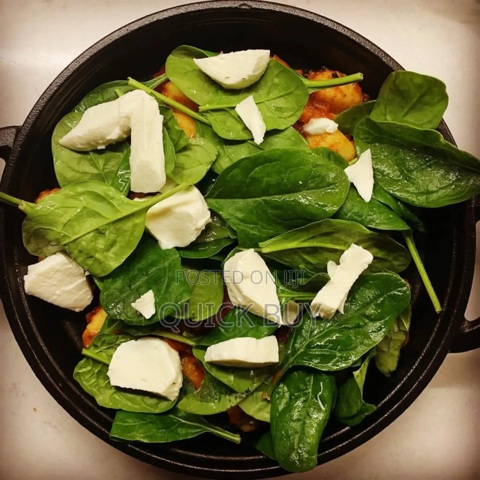 Cast Iron Sizzler Pan With a Wooden Serving Board.