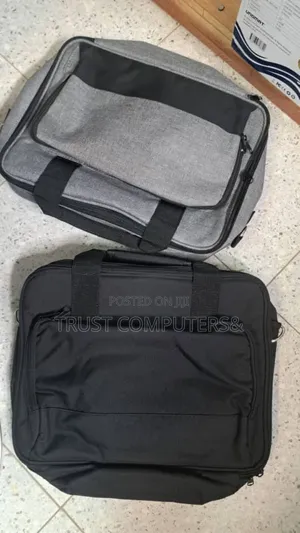 Black Carrying Case, Similar to Those Used for Projectors or Laptops.