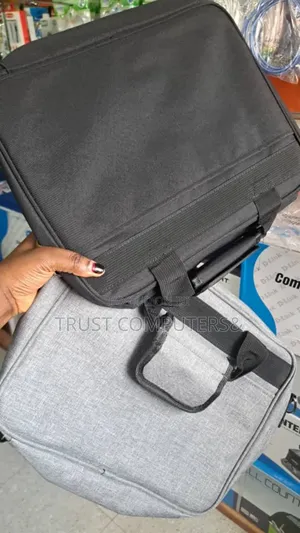 Black Carrying Case, Similar to Those Used for Projectors or Laptops.