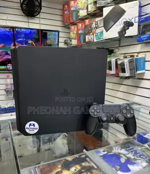 Clean Ps4 Slim With 2 Controllers and 10 Games Inside Fc26 Included