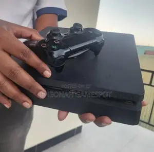 Ps4 Slim Good Condition With 2 Controllers and 15 Games Inside