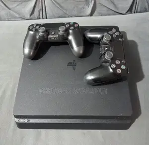Ps4 Slim Very Good Condition With 2 Controllers and 15 Games
