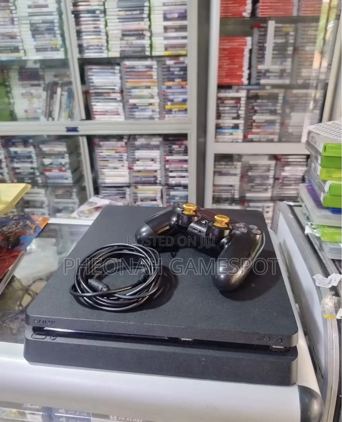 Playstation 4 Slim With 20 Extra Games , 2 Controllers and All Cables.