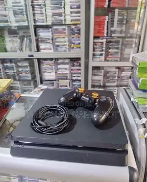 Playstation 4 Slim With 20 Extra Games , 2 Controllers and All Cables.
