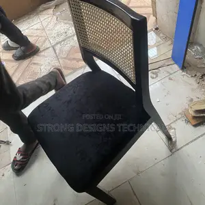A Pair of 2 Rattan Dining Chairs.