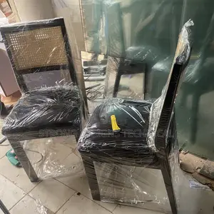 A Pair of 2 Rattan Dining Chairs.