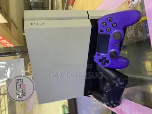 White and Black Ps4 Standard With 2 Blue and Black Pads