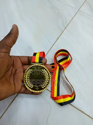 Gold Medal With a Red, Yellow, and Black Ribbon