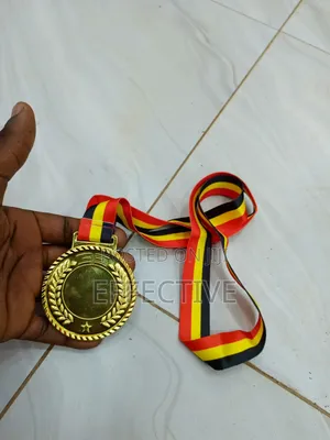 Gold Medal With a Red, Yellow, and Black Ribbon