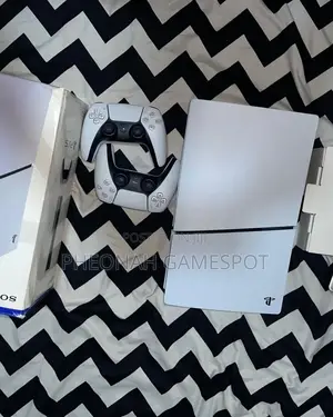 Compact Ps5 Slim Unit, Excellent Shape, 2 Pads, 5 Games.