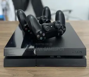 Playstation 4 , 2 Controllers, 12 Cool Games Installed.