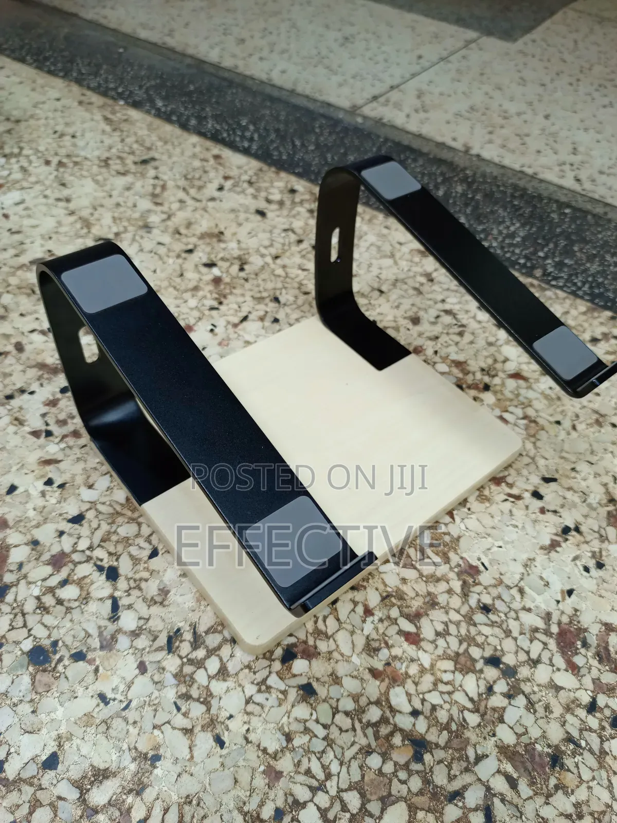 Portable Laptop Stand With a Wooden Base and Black Metal Frame.