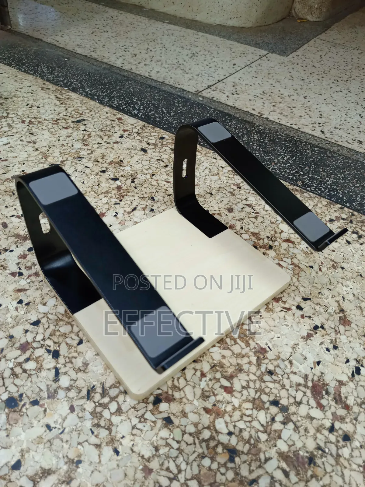 Portable Laptop Stand With a Wooden Base and Black Metal Frame.