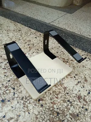 Portable Laptop Stand With a Wooden Base and Black Metal Frame.