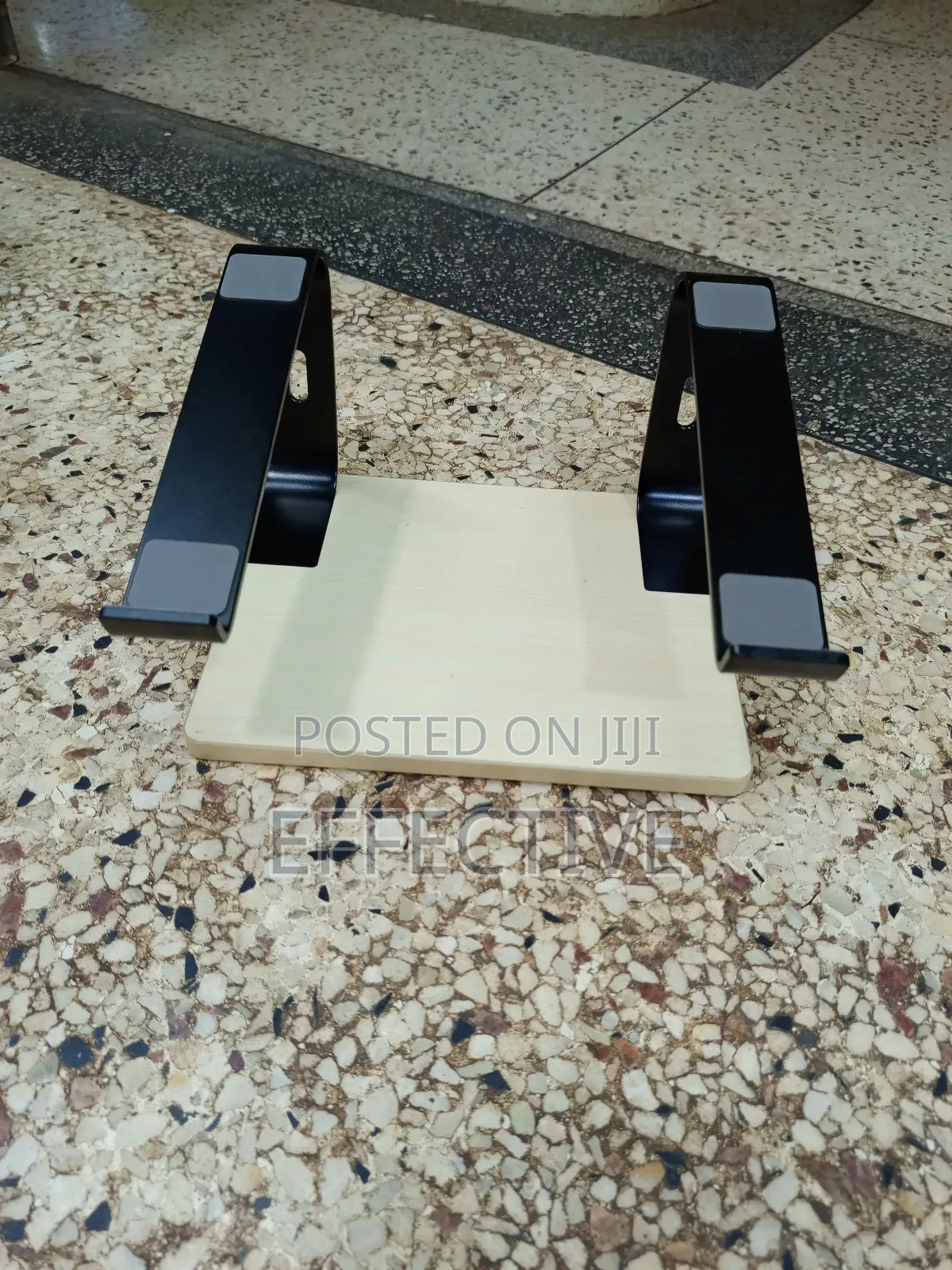 Portable Laptop Stand With a Wooden Base and Black Metal Frame.