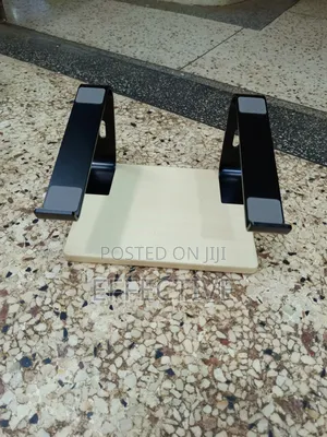 Portable Laptop Stand With a Wooden Base and Black Metal Frame.